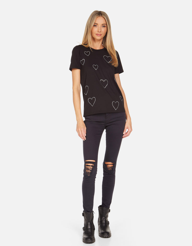 Front Black Short Sleeve Shirt with crystal heart, wearing distressed jeans and black leather combat boots